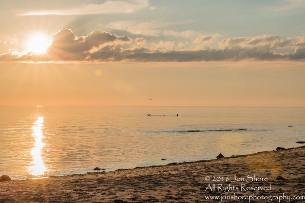Sunset Tuja, Latvia with boys in the sea. Tamron 200m