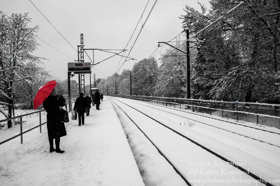 Red umbrella at Zolitude Train Station. Nikkor 50mm