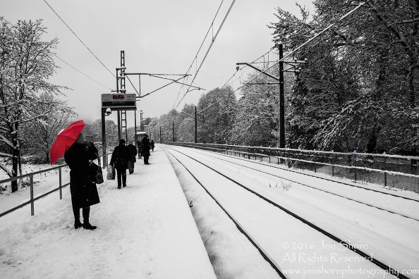Red umbrella at Zolitude Train Station. Nikkor 50mm