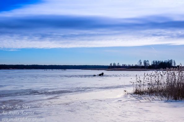 Ice Fishing on the Lielupe River in Winter. Nikkor 300mm