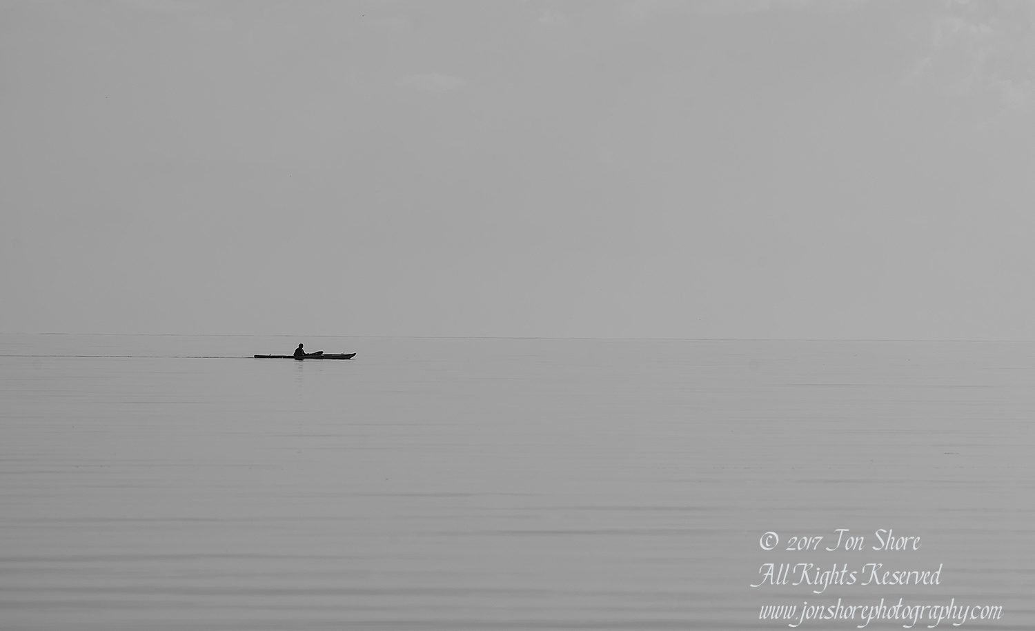 Kayak on still sea Tuja Latvia BW, Tamron 300mm
