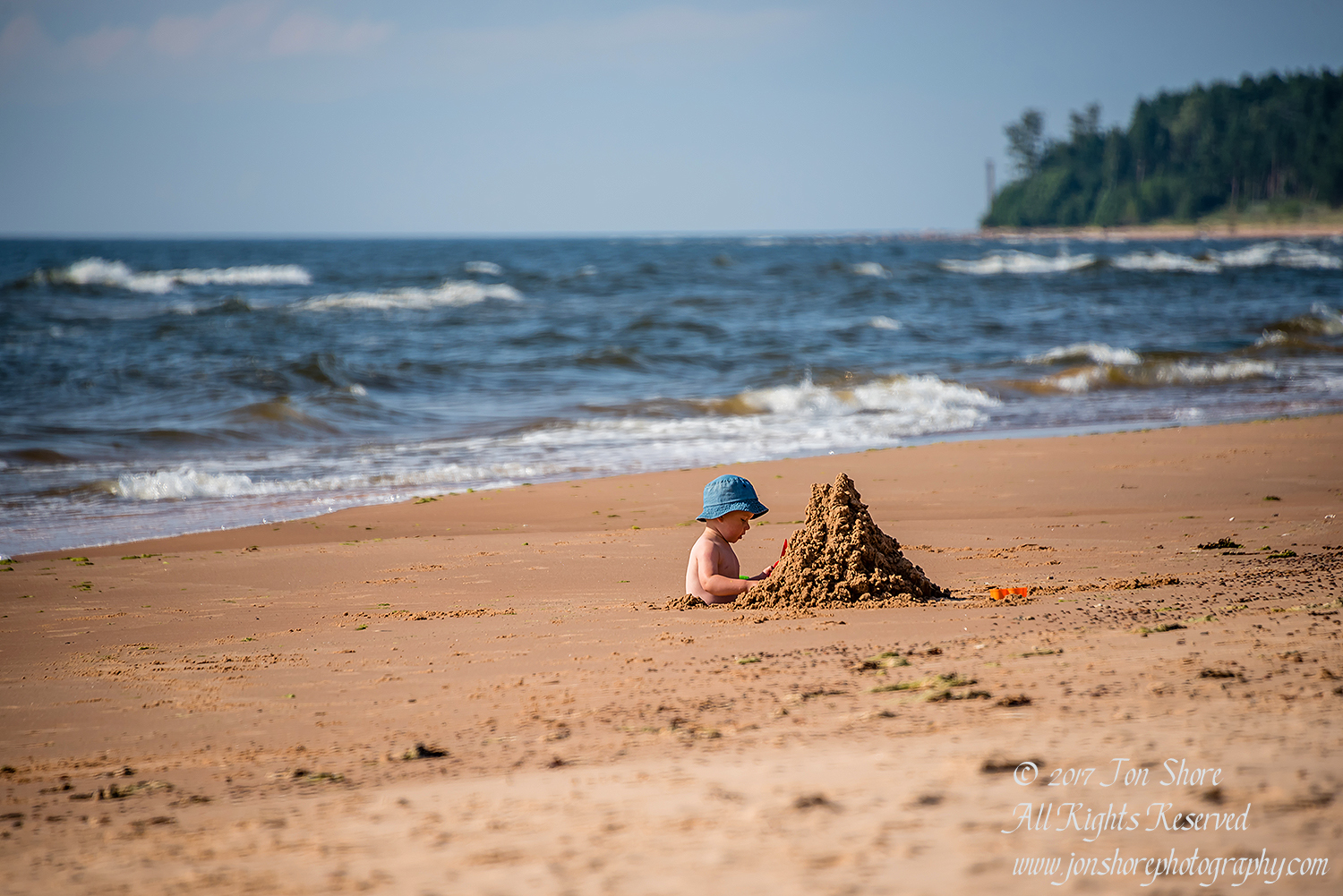 Boy in Hole Building a Castle in Tuja Latvia