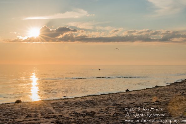 Sunset Tuja, Latvia with boys in the sea. Tamron 200m